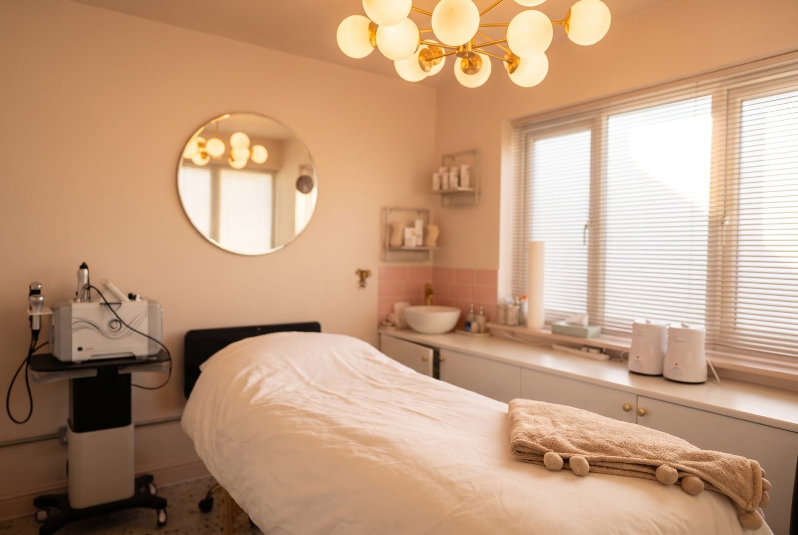 The advanced facials treatment room at NU Beauty in Haverhill, with a dressed treatment bed and a skincare machine, ready for a dermaplaning facial