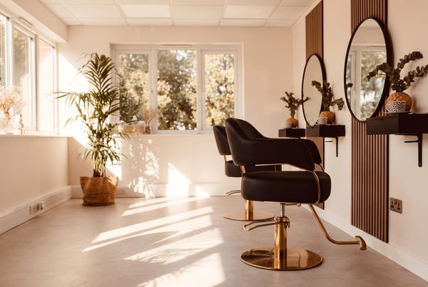 A styling chair at NU Beauty's Haverhill hair studio, set up for a hair extensions fitting