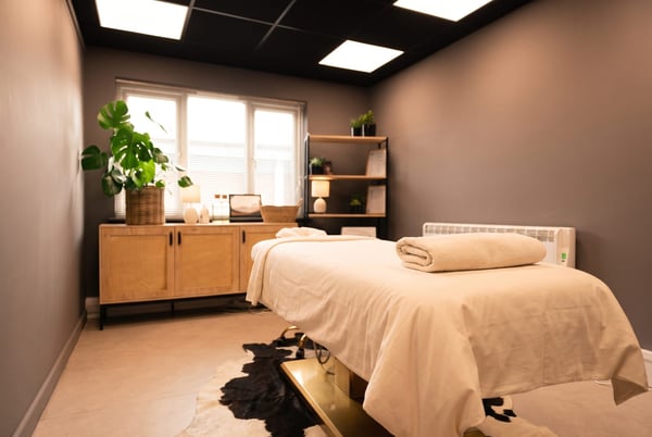 The calm massage room at NU Beauty in Haverhill, dressed for a sports or deep tissue massage