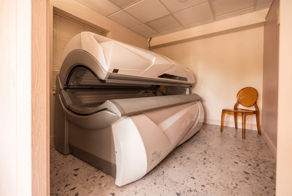 The sunbed room at NU Beauty in Haverhill, lit warm and calm
