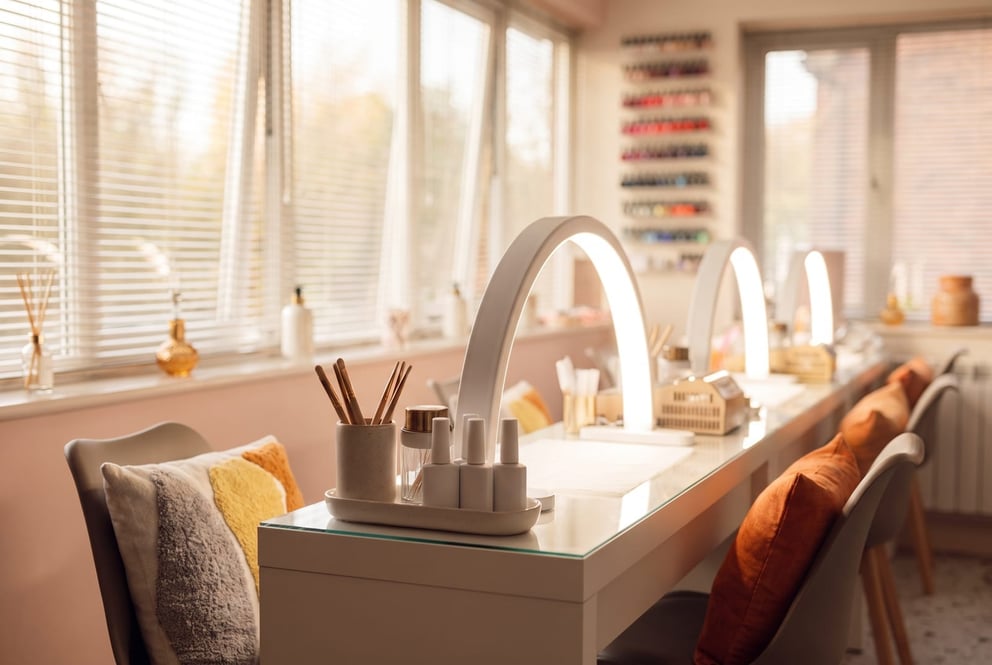 A manicure station at NU Beauty in Haverhill, with nail brushes and builder gel ready under the LED lamp
